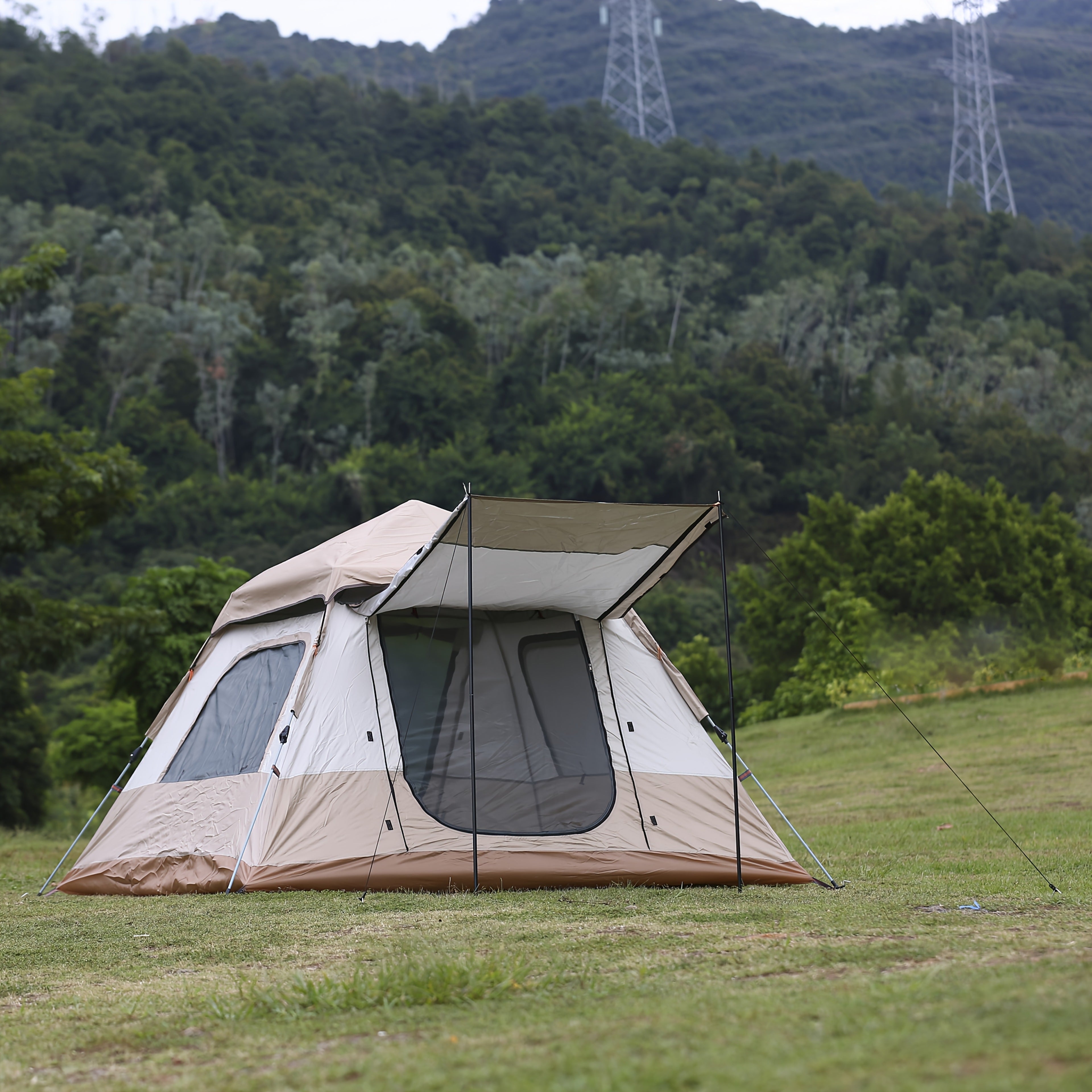 A Camping Tent That Is Portable, Has Four Sides, Opens Quickly, And Includes Double Doors And Four Windows, Designed with Panoramic Mesh for Airflow And a Vestibule